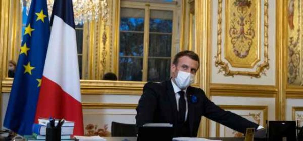 French President Emmanuel Macron speaks on the telephone to US President-elect Joe Biden, at the Elysee Palace in Paris, Tuesday, Nov. 10, 2020. (Ian Langsdon, Pool via AP)